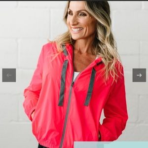 Zyia windbreaker jacket. Worn once, color is a pink/coral
